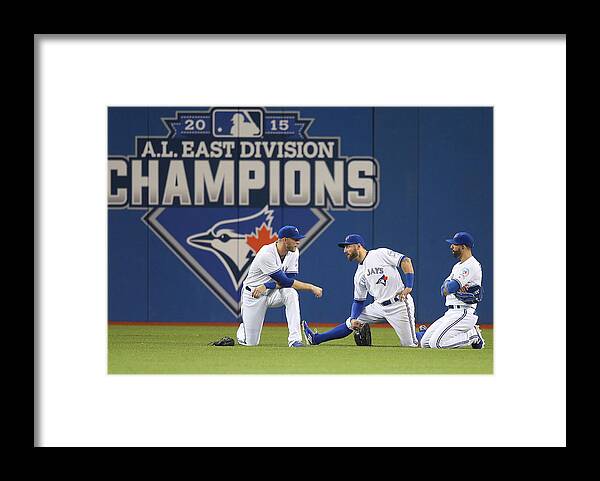 People Framed Print featuring the photograph Kevin Pillar and Michael Saunders by Tom Szczerbowski
