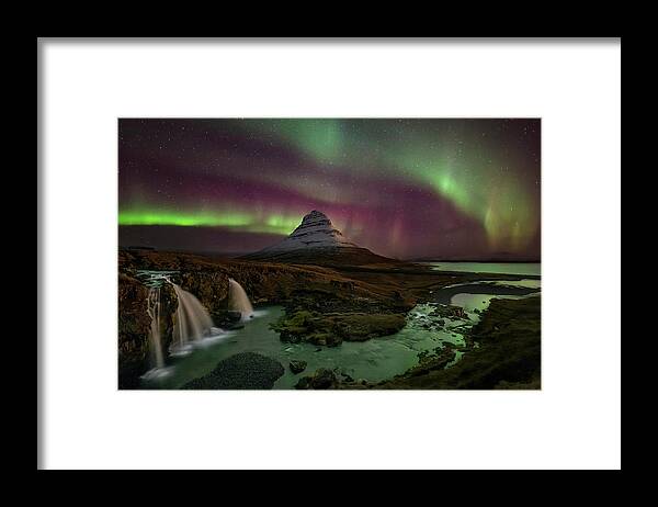 Northern Lights Framed Print featuring the photograph Kirkjufellsfoss Greets the Northern Lights by Roman Kurywczak