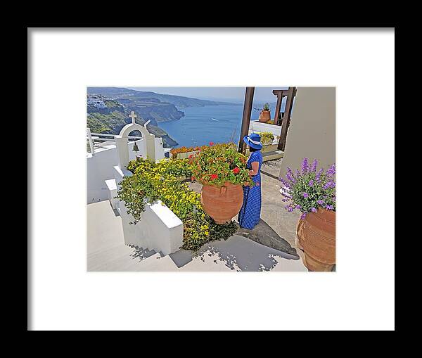 Santorini Framed Print featuring the photograph Lady in blue in Santorini by Yvonne Jasinski