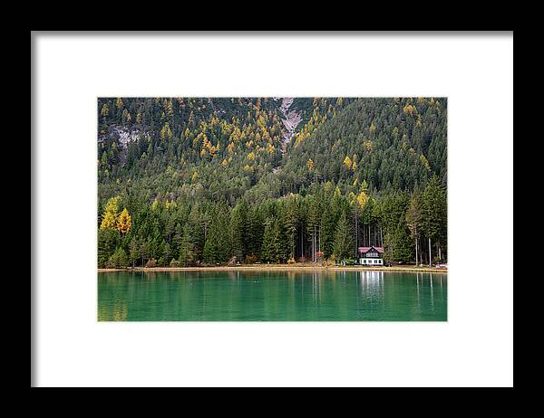 Italy Framed Print featuring the photograph House in the lake and forest. Lago di dobbiaco lake. Italian aps by Michalakis Ppalis