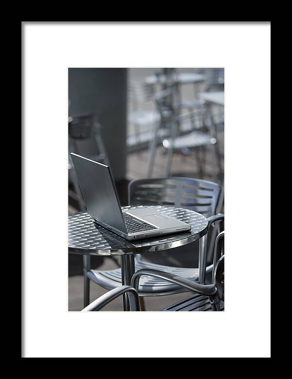 Computer Framed Print featuring the photograph Laptop at a cafe by Comstock Images
