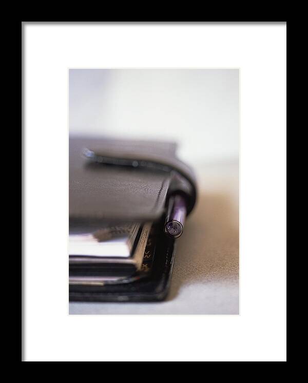 Black Color Framed Print featuring the photograph Leather diary, close-up by Michele Constantini