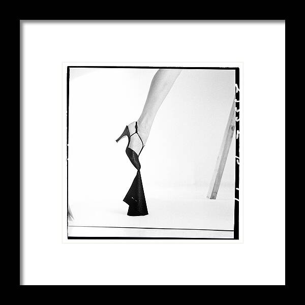 1950s Style Framed Print featuring the photograph Leg Of A Model Wearing a T-Strap Sandal by Richard Rutledge