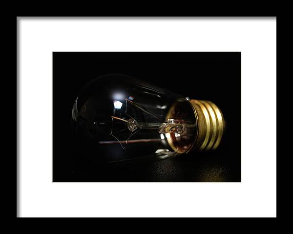 Bulb Framed Print featuring the photograph Light Bulb by Amelia Pearn