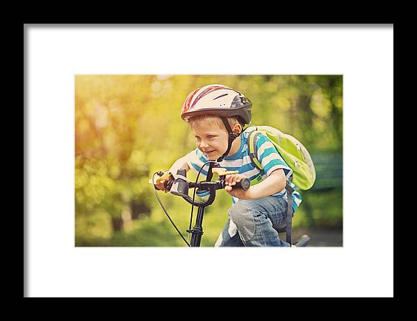 4-5 Years Framed Print featuring the photograph Little boy riding a bike by Imgorthand