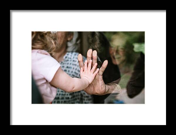 Toddler Framed Print featuring the photograph Little Girl Visits Grandparents Through Window by RyanJLane