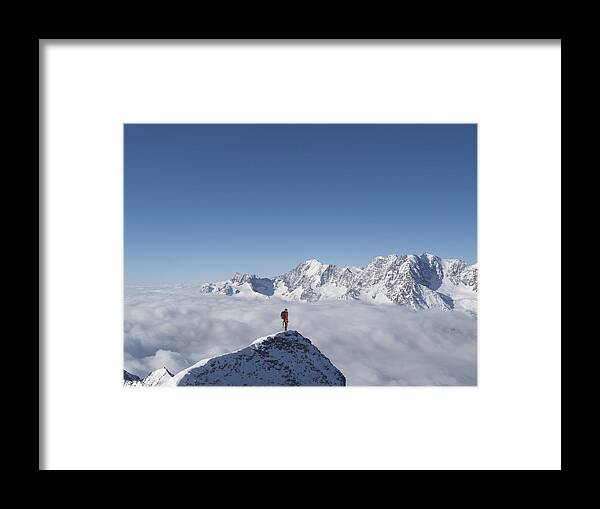 Mature Adult Framed Print featuring the photograph Lone climber on top of a snowy peak by Buena Vista Images