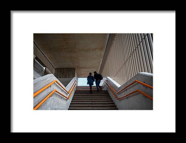 Steps Framed Print featuring the photograph Low angle view of a woman and a man moving up the steps by Photographer, Basak Gurbuz Derman