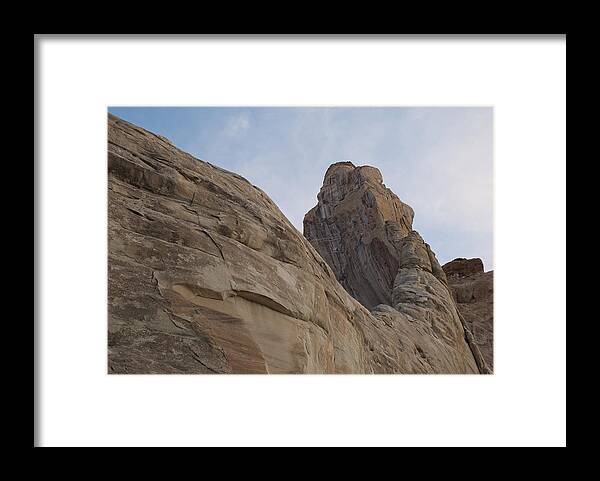 Geology Framed Print featuring the photograph Low angle view of rock formations by Fotosearch