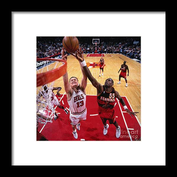 Nba Pro Basketball Framed Print featuring the photograph Luc Longley and Dikembe Mutombo by Glenn James