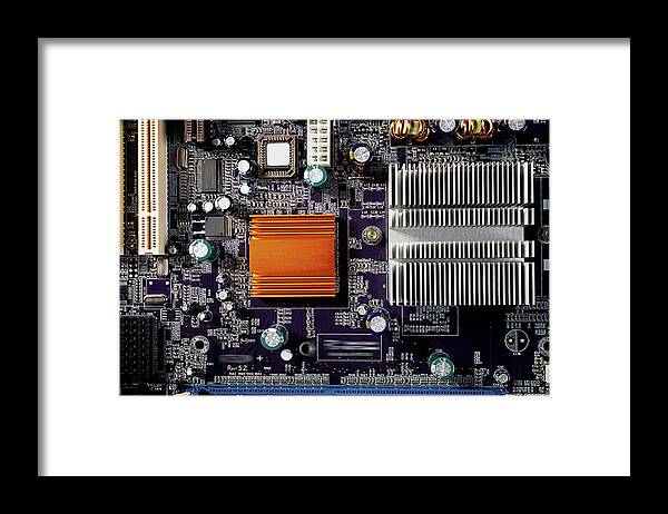 Computer Framed Print featuring the photograph Mainboard of a pc with electronic components. by Bernhard Schaffer