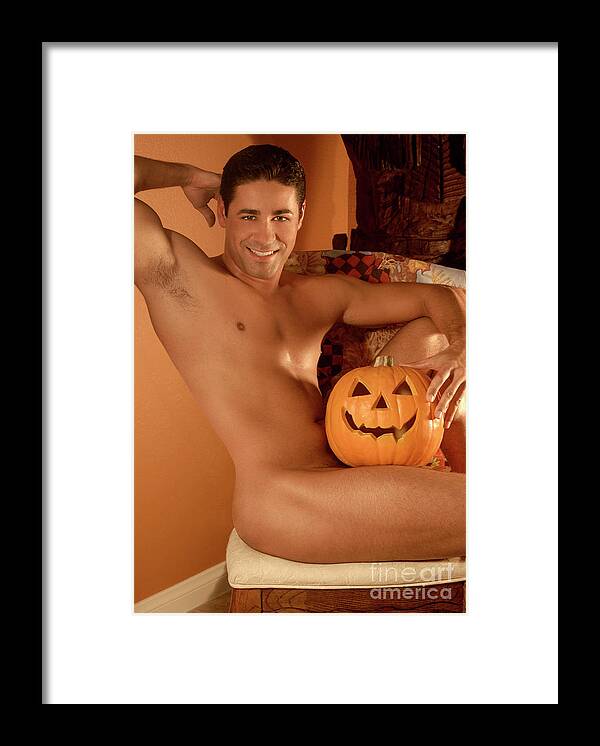 Young Framed Print featuring the photograph Male nude with Halloween Pumpkin by Gunther Allen