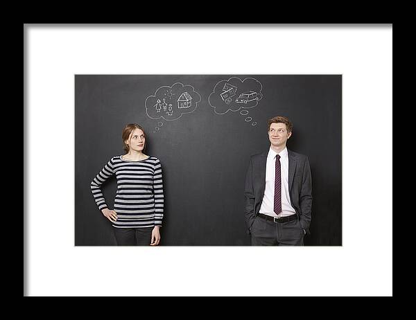 Young Men Framed Print featuring the photograph Man and woman thinking about their future by Chris Tobin