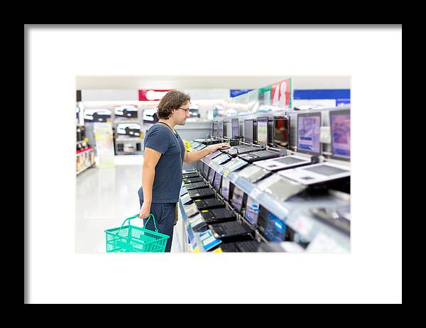 People Framed Print featuring the photograph Man Buying A Laptop by 97