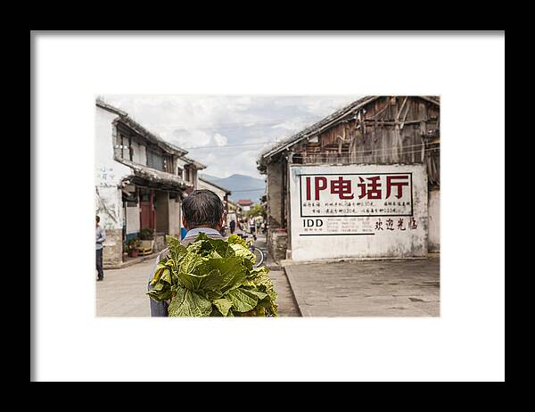 People Framed Print featuring the photograph Man carrying vegetables on his back by Merten Snijders
