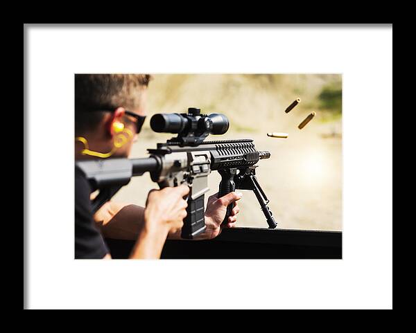 Rifle Framed Print featuring the photograph Man shooting rife by Daniel Grill