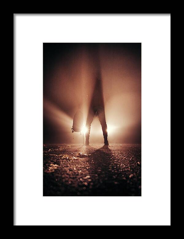 Figure Framed Print featuring the photograph Man stands in car lights by Vaclav Sonnek