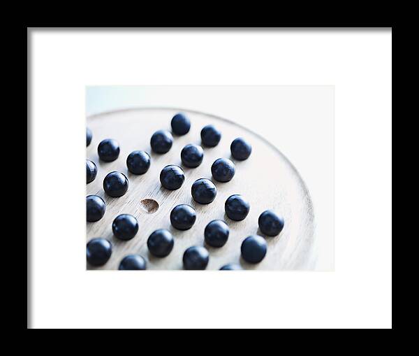 Sports Ball Framed Print featuring the photograph Marbles on Chinese checkers board by Martin Barraud