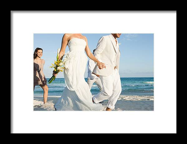 Groom Framed Print featuring the photograph Married couple on beach with friends by Image Source
