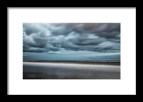 Clouds Framed Print featuring the photograph Menacing Clouds Over Atlantic Beach by Bob Decker