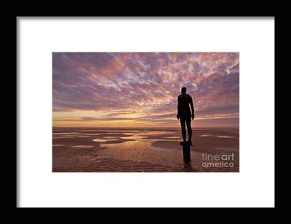 Another Place Framed Print featuring the photograph Metal statues on Crosby beach, Merseyside, England by Neale And Judith Clark