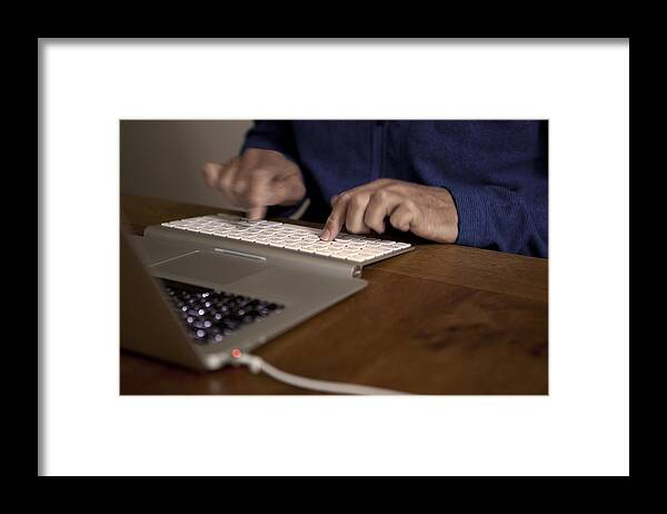 People Framed Print featuring the photograph Midsection Of Man Using Laptop On Table by Paulien Tabak / EyeEm