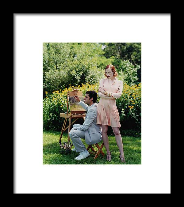 Fashion Framed Print featuring the photograph Model Karen Elson With Man Painting Outdoors by Arthur Elgort