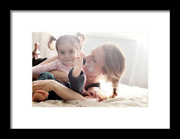 Toddler Framed Print featuring the photograph Mom having fun with her toddler by Kristina Hernandez