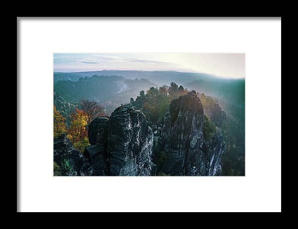 Saxon Switzerland Framed Print featuring the photograph Morning mist on the Bastei rocks in Saxon Switzerland by Sun Travels