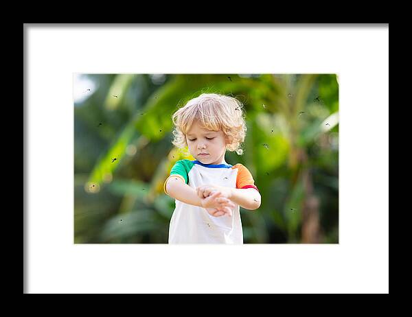 Allergy Medicine Framed Print featuring the photograph Mosquito on kids skin. Insect bite repellent. by FamVeld