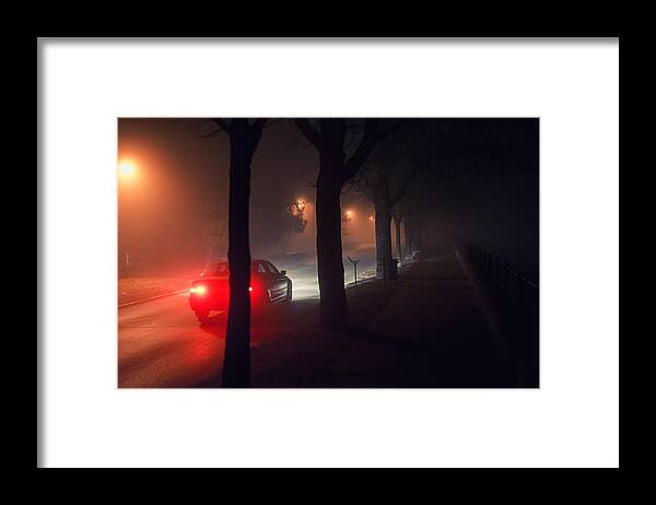 Black Color Framed Print featuring the photograph Moving car and walkway on misty night by Slavica