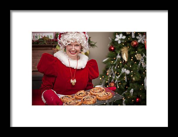 Senior Women Framed Print featuring the photograph Ms. Claus With Cinnamon Rolls by Avid_creative