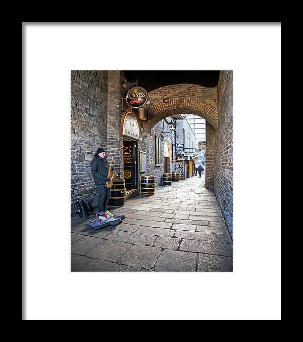 Dublin Framed Print featuring the photograph Musician under Merchant's Arch - Dublin by Barry O Carroll