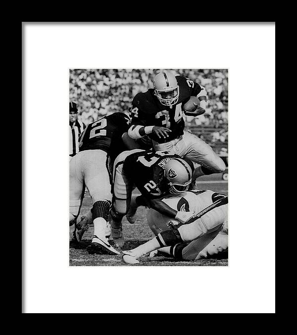 1980-1989 Framed Print featuring the photograph Napoleon McCallum of the Los Angeles Raiders... by The Sporting News