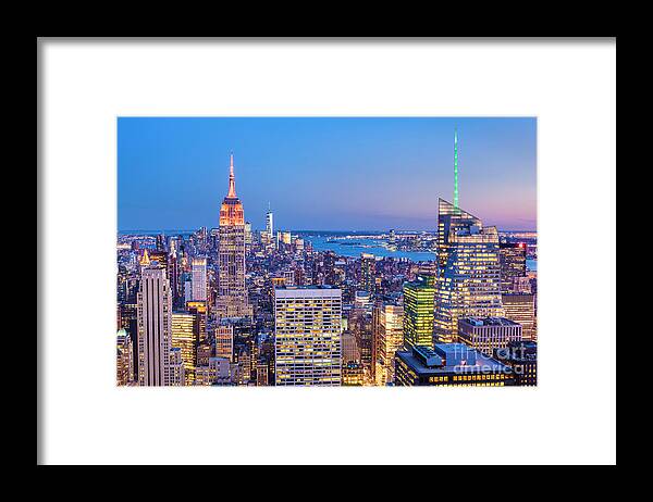New York City Skyline At Night Framed Print featuring the photograph New York Skyline at Sunset by Neale And Judith Clark