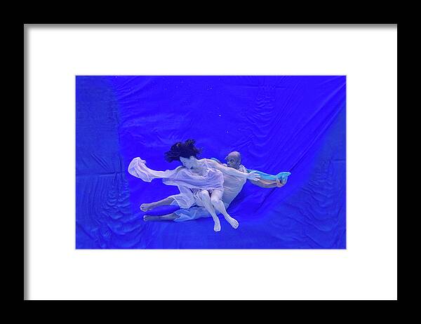 Nina Framed Print featuring the photograph Nina and General dancing underwater in front of blue background 8 by Dan Friend