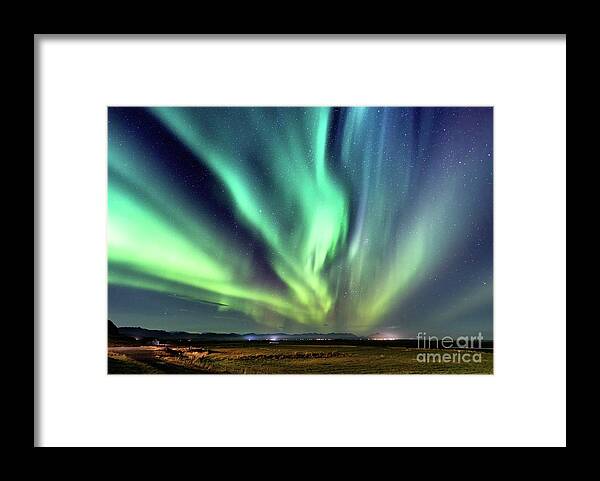 Iceland Framed Print featuring the photograph Northern lights, Aurora Borealis in the night sky, Iceland. Thes by Jane Rix