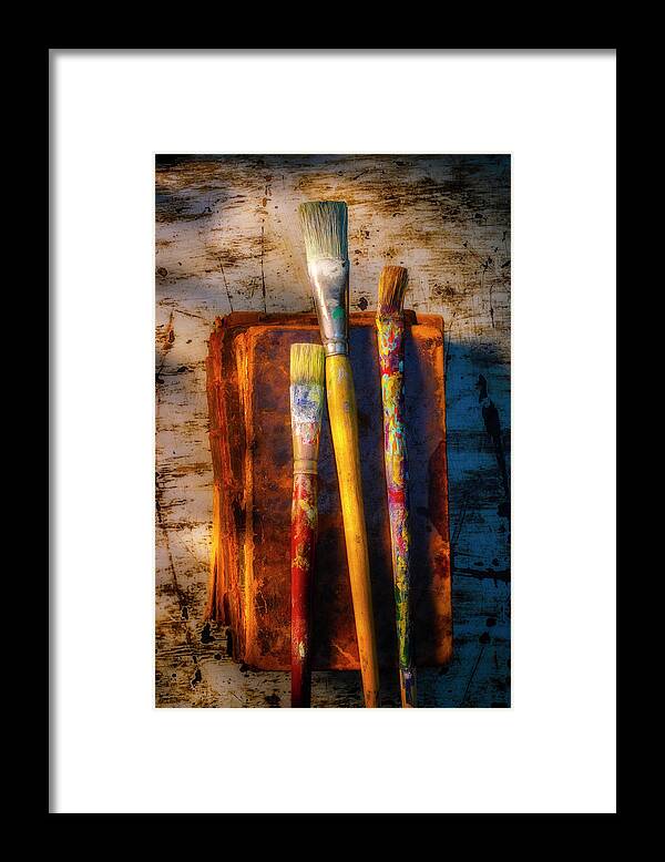 Old Framed Print featuring the photograph Old Paint Brushes On Weathered Books by Garry Gay