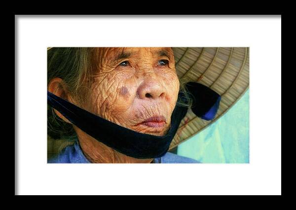 Hat Framed Print featuring the photograph Old Vietnamese lady with the conical hat by Robert Bociaga