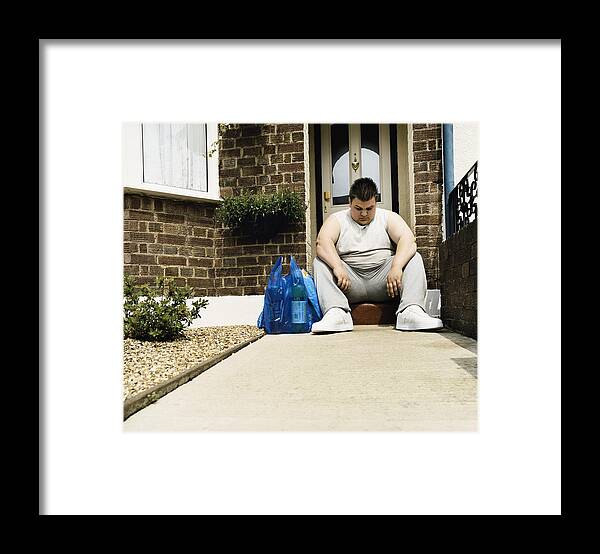 Outdoors Framed Print featuring the photograph Overweight Man Sits Next to His Shopping on a Doorstep by Digital Vision.