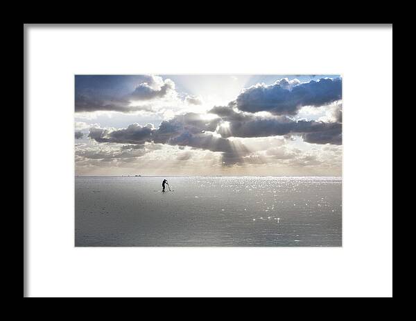 Clouds Framed Print featuring the photograph Paddleboarder under the Sun by Debra and Dave Vanderlaan