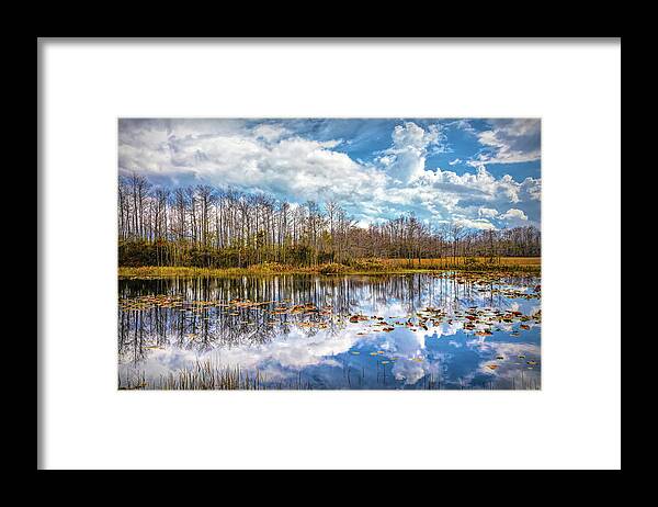 Clouds Framed Print featuring the photograph Peaceful Autumn Reflections on the Everglades by Debra and Dave Vanderlaan