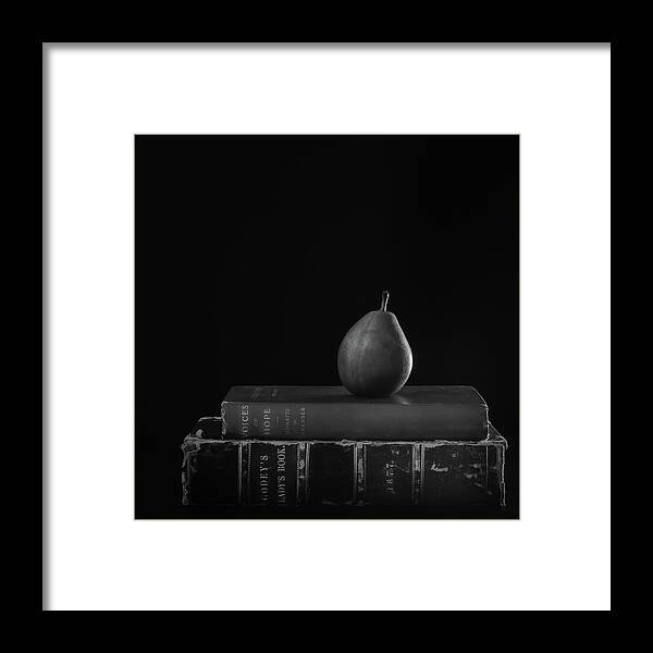 Pear Framed Print featuring the photograph Pear on Books by Sylvia Goldkranz