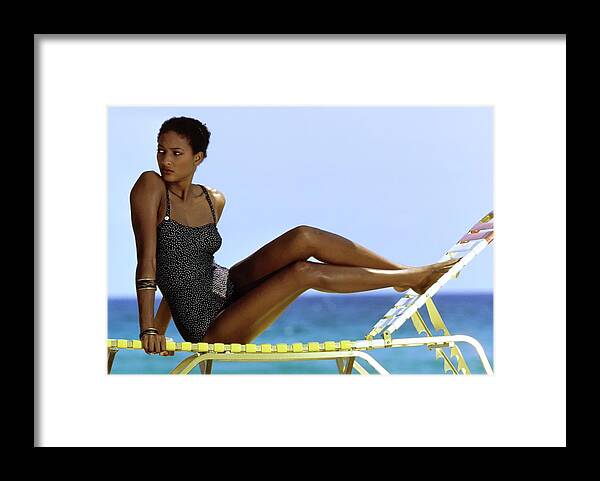 Fashion Framed Print featuring the photograph Peggy Dillard in a Polkadot Swimsuit by Guy le Baube