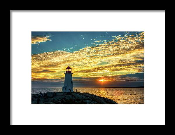 Peggy's Cove Framed Print featuring the photograph Peggy's Cove Lighthouse at Sunset by Tatiana Travelways