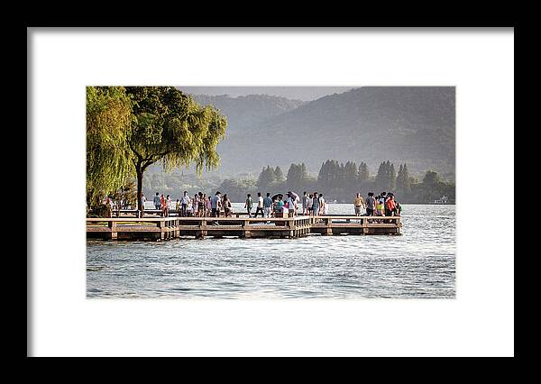 2013 Framed Print featuring the photograph People strolling at the edge of the West Lake by Benoit Bruchez