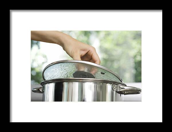 People Framed Print featuring the photograph Person removing lid from cooking pot by PhotoAlto/Laurence Mouton