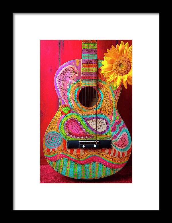Musical Framed Print featuring the photograph Poetry Guitar Leaning Against Red Wall by Garry Gay