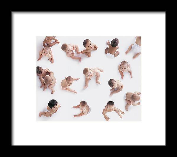 People Framed Print featuring the photograph Portrait of a Large Group of Babies Looking Upwards by Digital Vision.