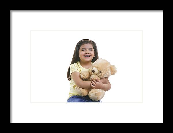 Child Framed Print featuring the photograph Portrait of a little girl with a teddy bear by Sudipta Halder